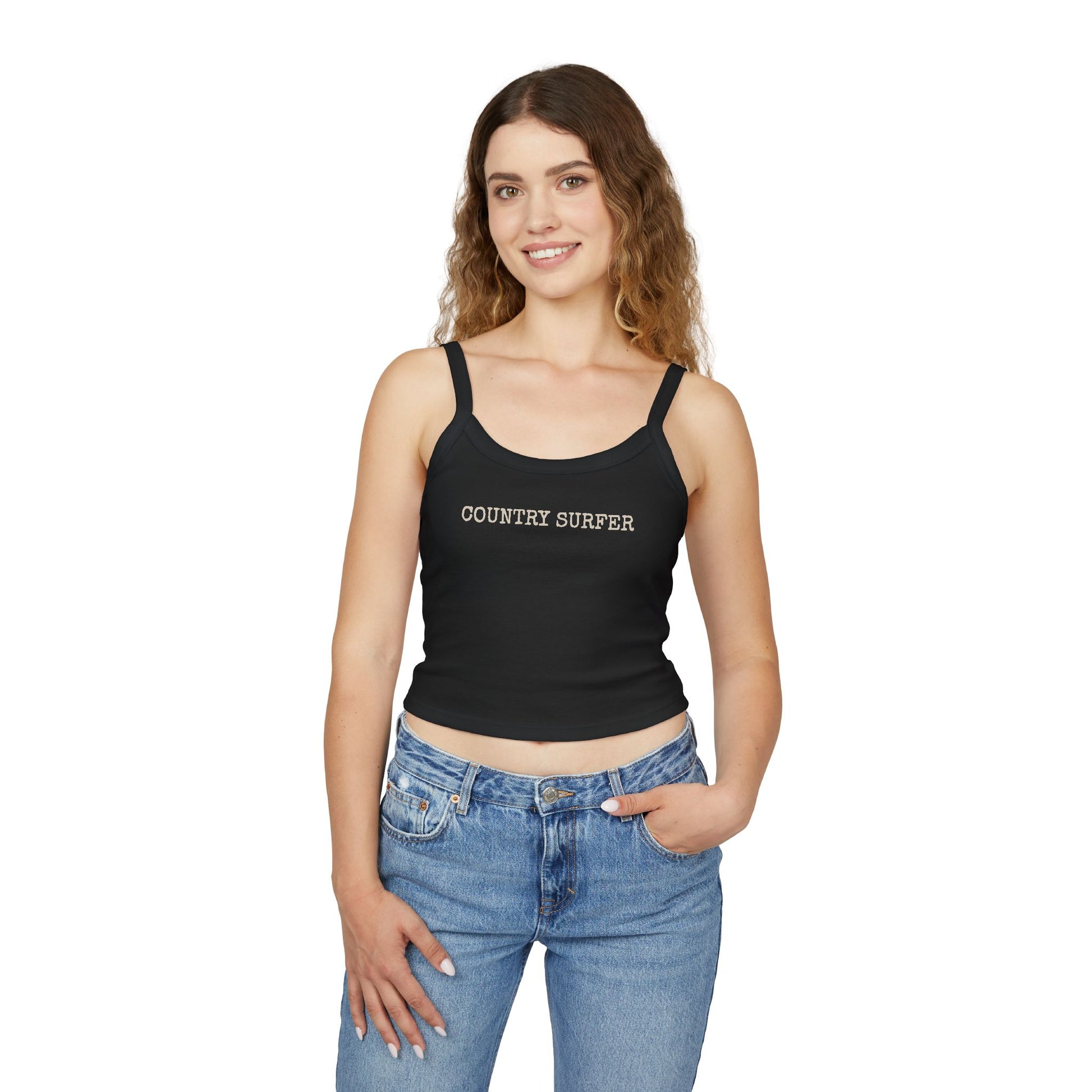 Woman wearing a black tank top with 'COUNTRY SURFER' text and blue jeans on a white background